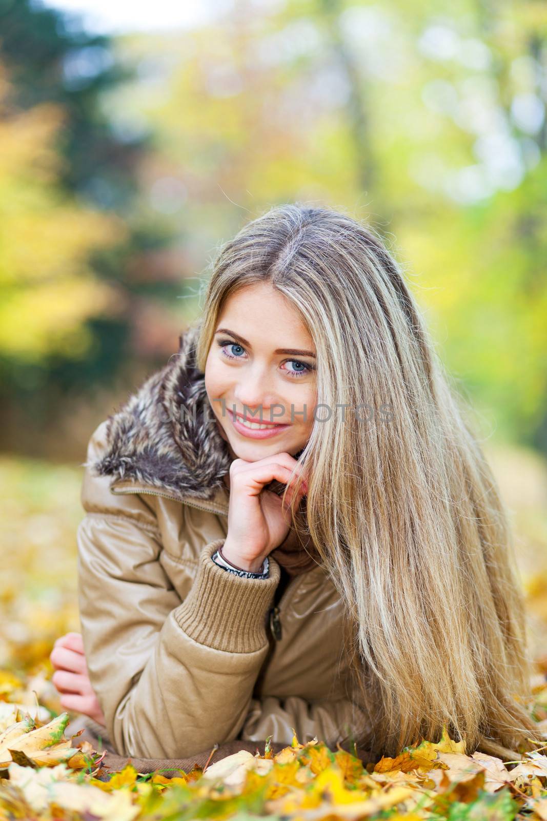 Young woman smiling in autumn by TristanBM