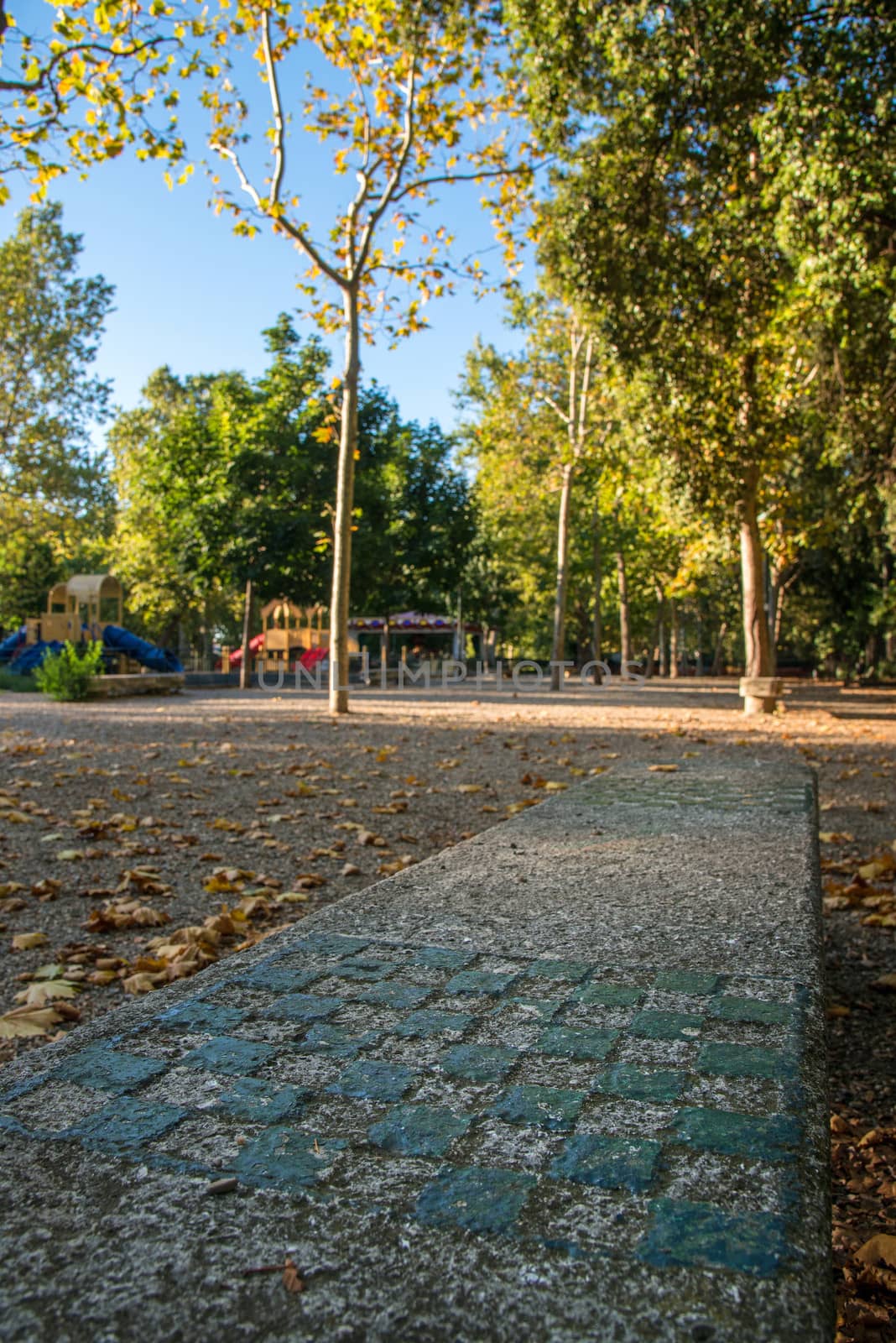 chessboard carved on a bench in a public park






