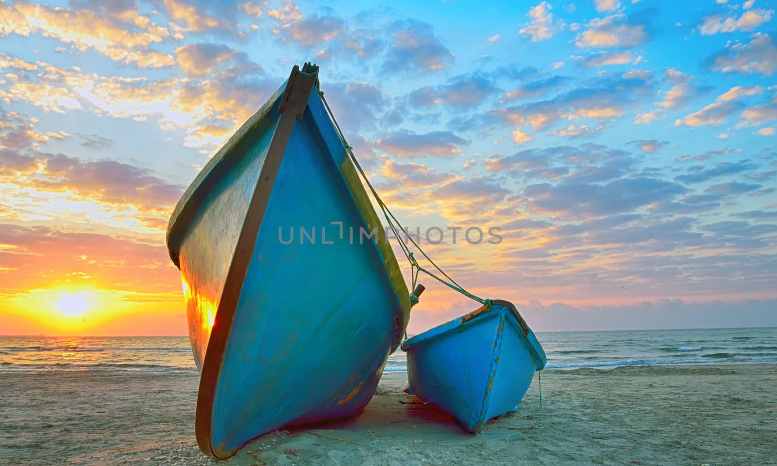 Fishing boats and sunrise on Black Sea beach