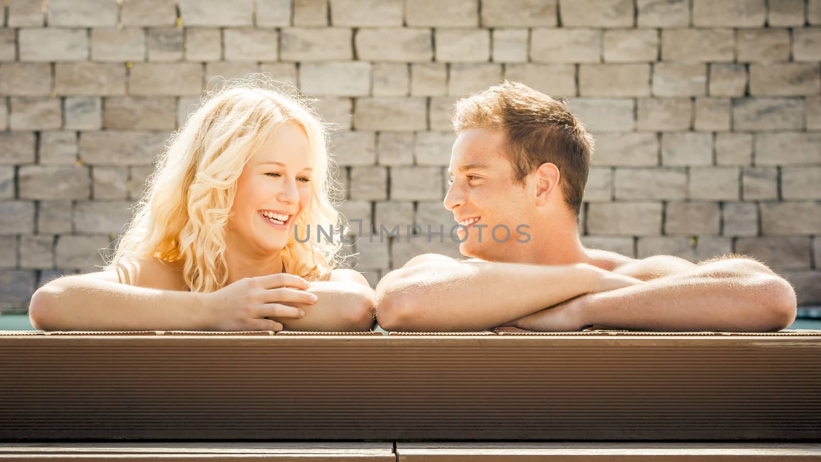 An image of a young couple at the pool
