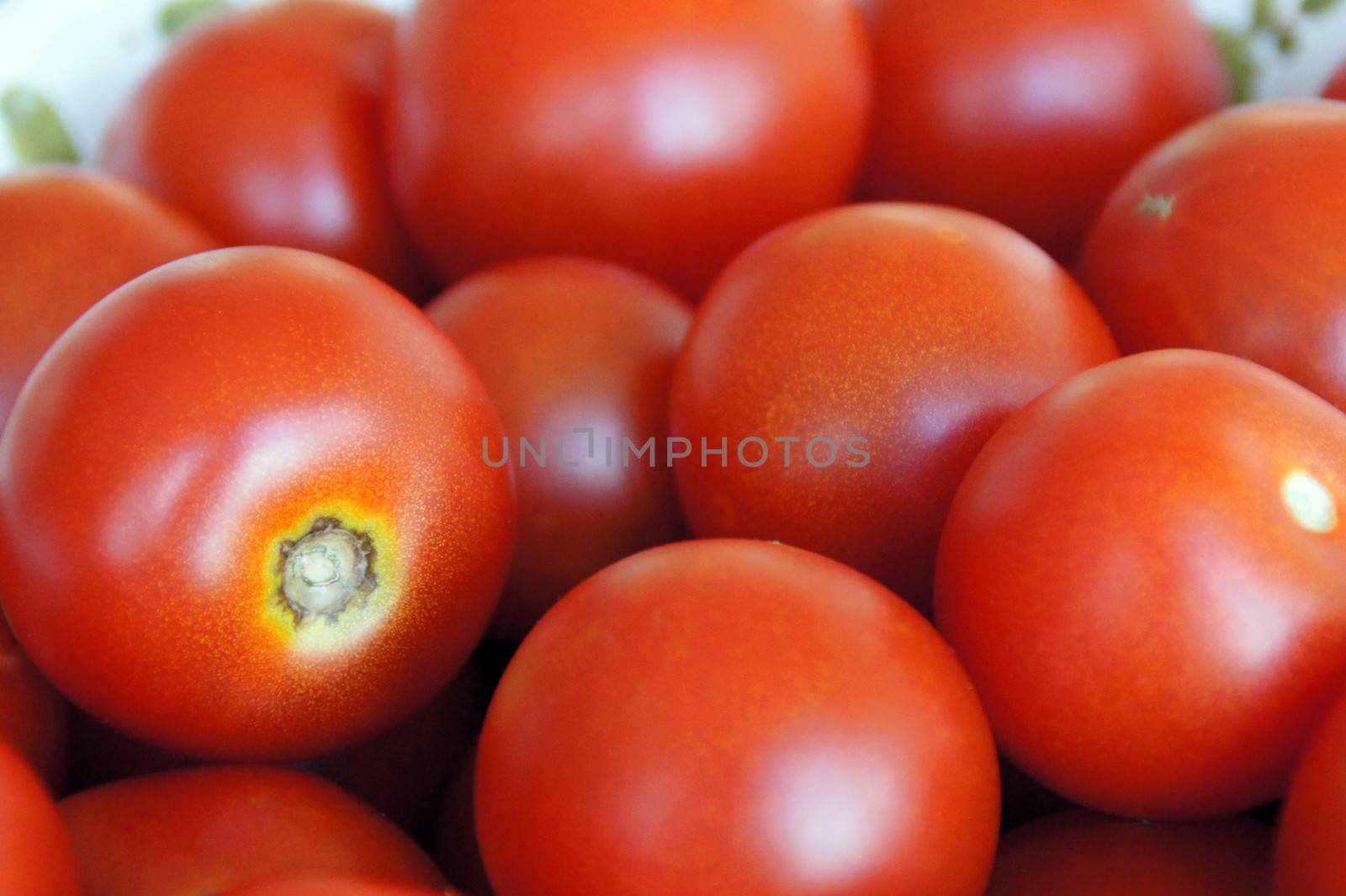 closeup of a bunch of fresh tomatoes