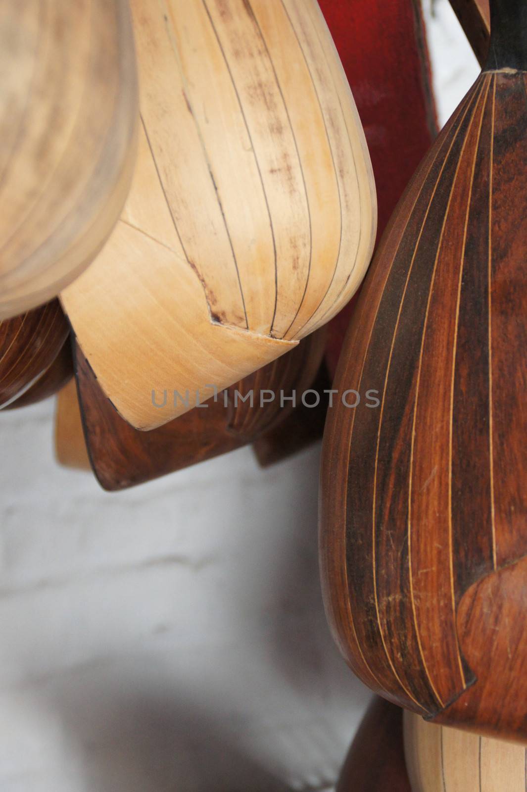 closeup of wooden bodies of antique mandolins