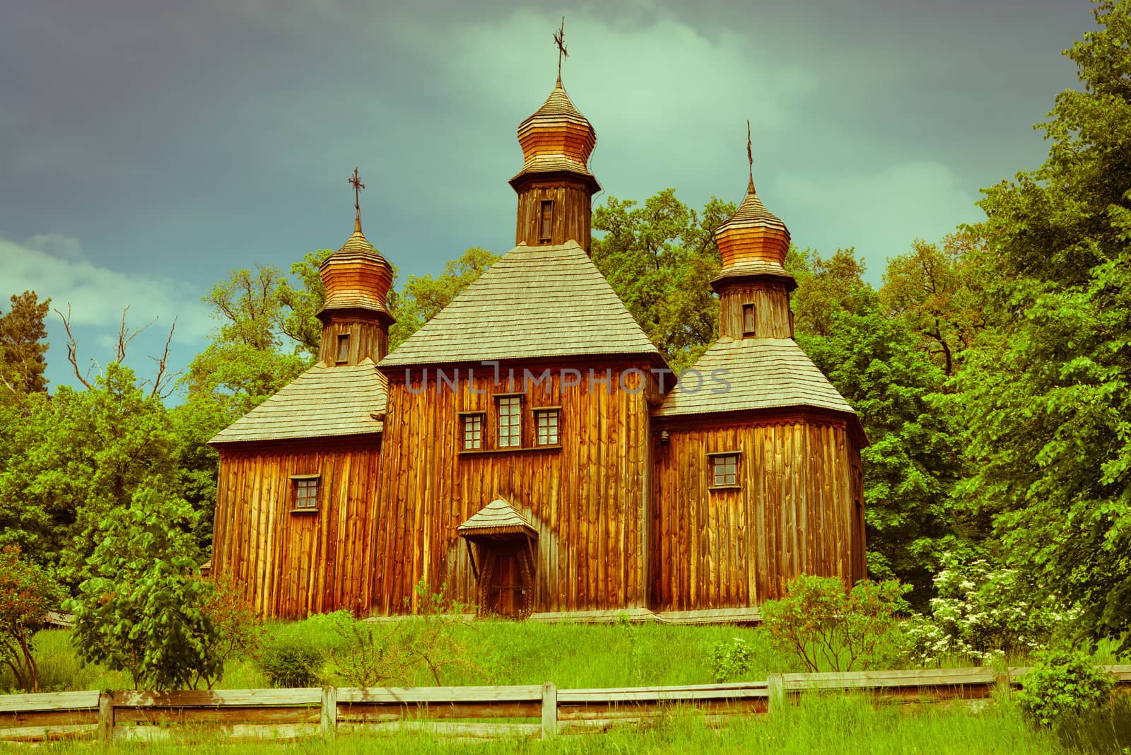 Vintage antique Slavonic wooden church at ethnographic museum Pirogovo, Kiev, Ukraine