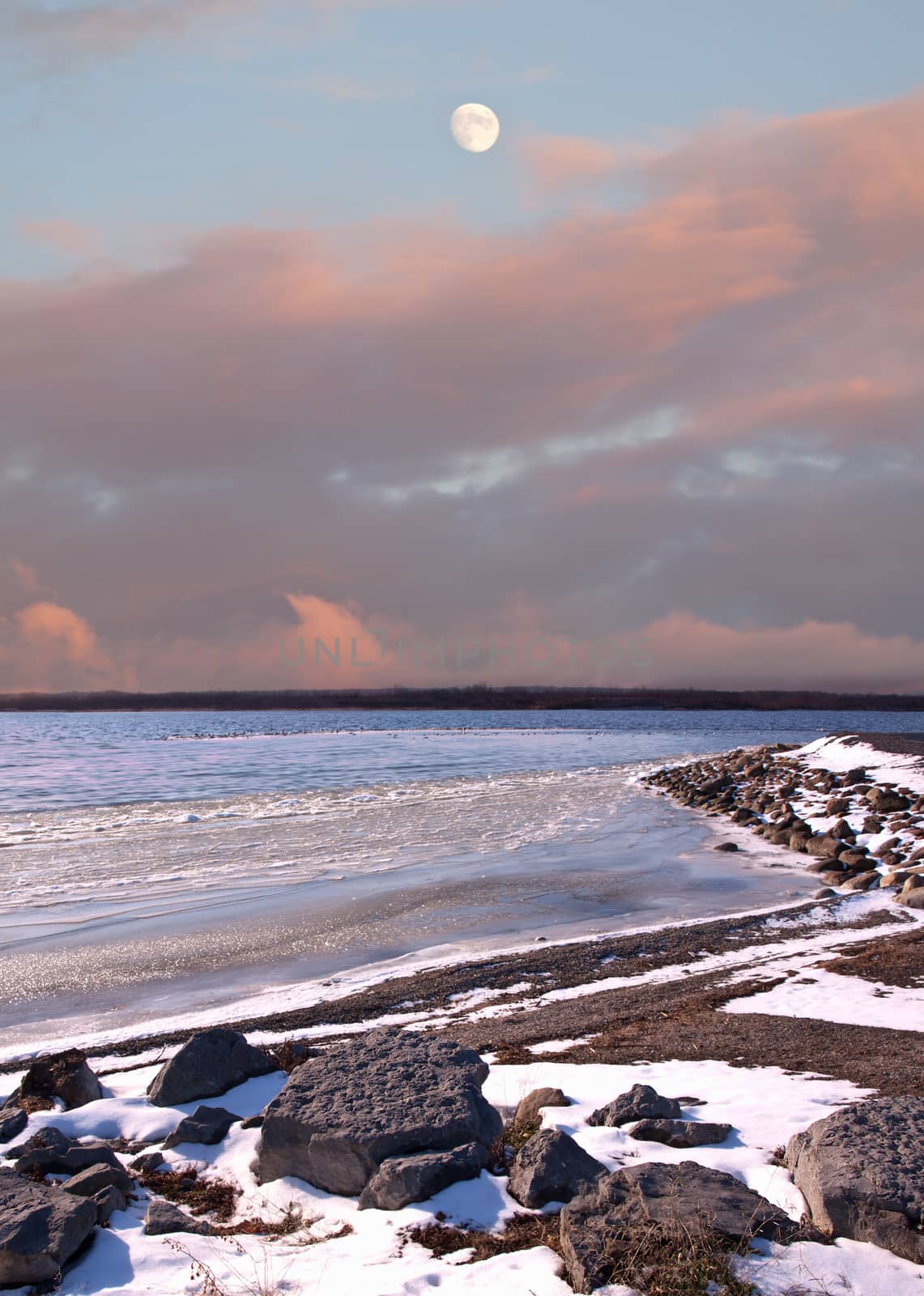 moon and snowy winter coastline scene