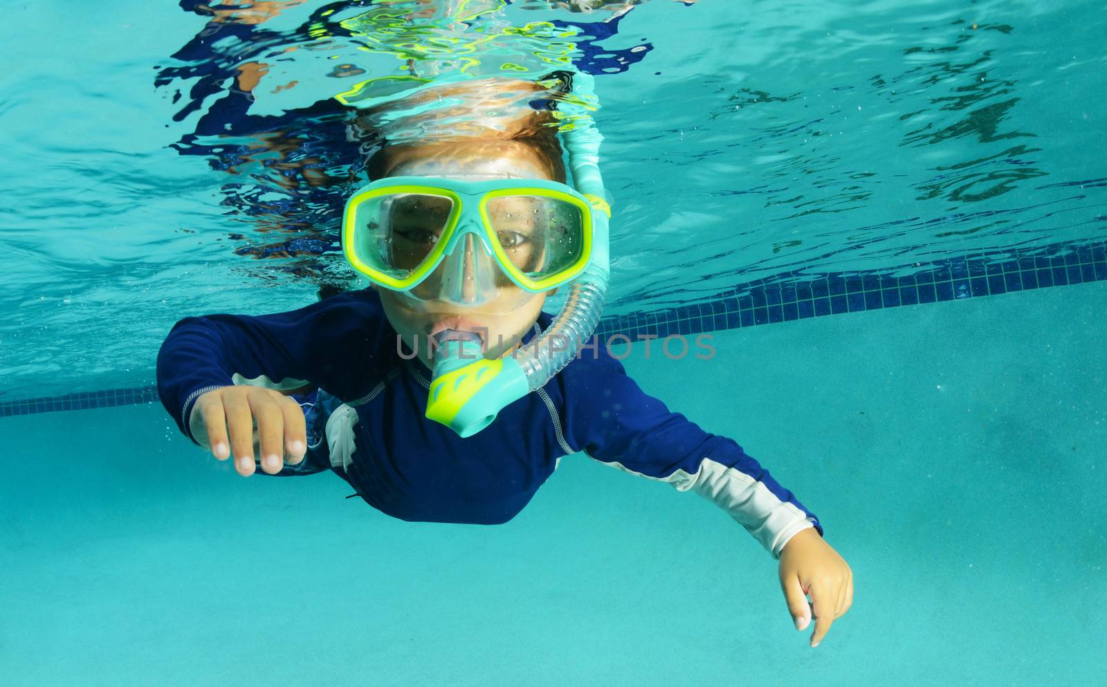 snorkeling child in pool for recreation