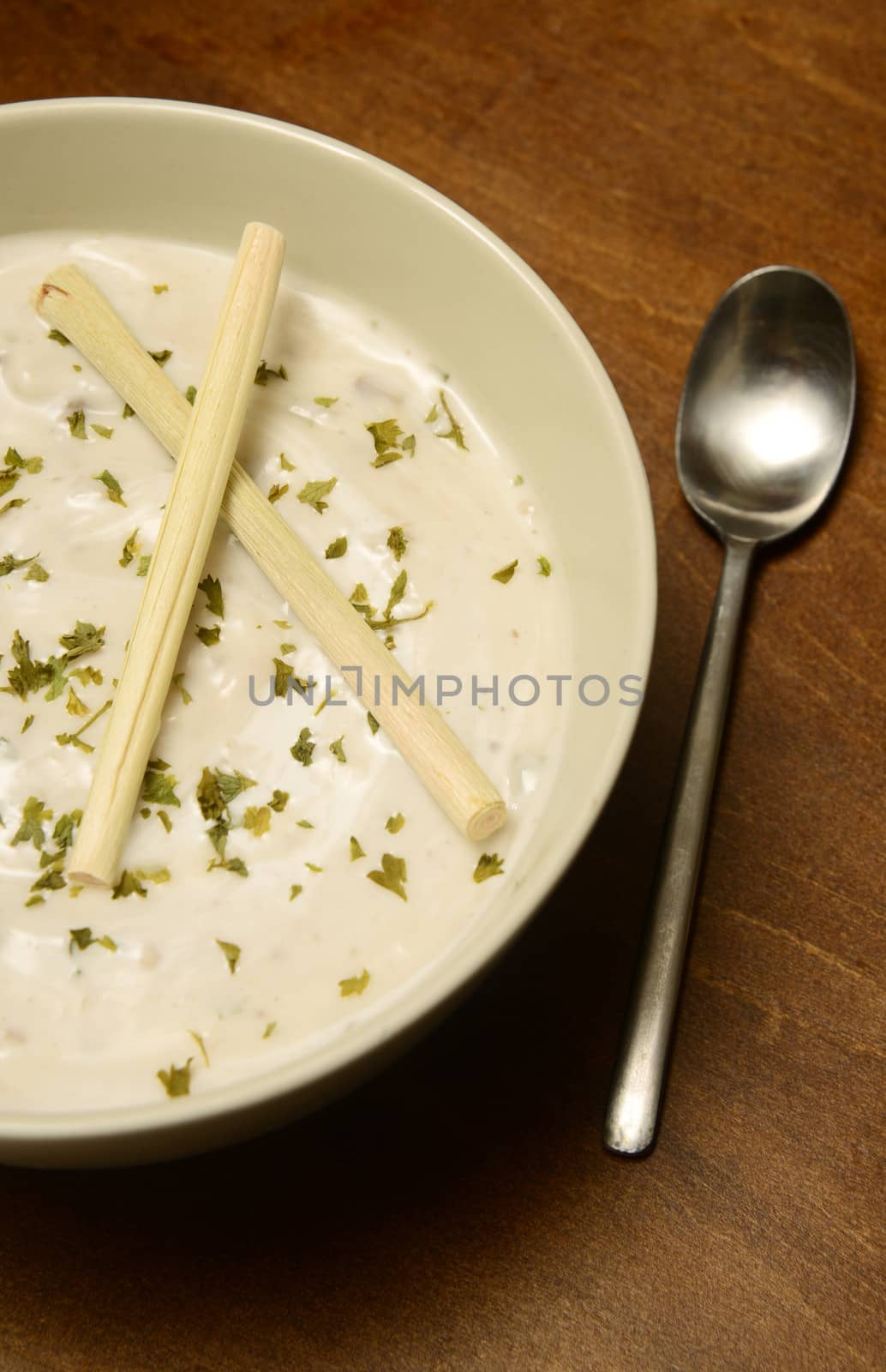 bowl of lemongrass soup on wood table for creamy meal