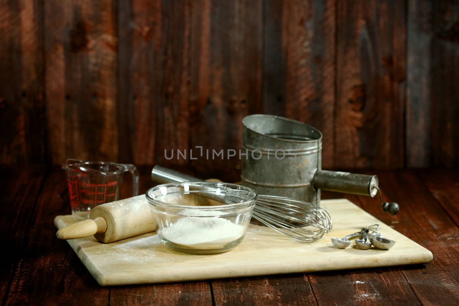 Bread Baking Ingredients on a Wooden Background by tobkatrina