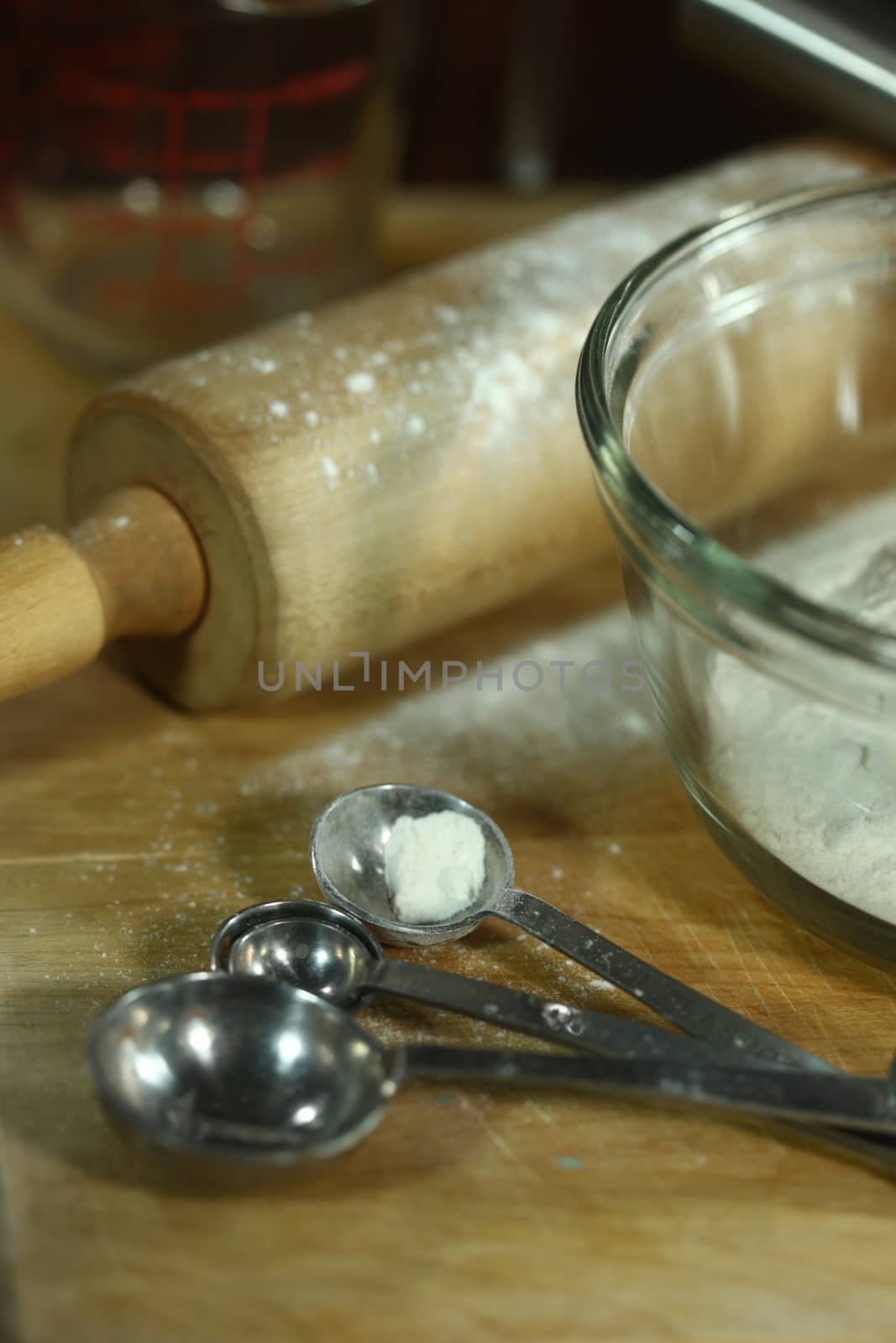 Bread Baking Ingredients on a Wooden Background by tobkatrina