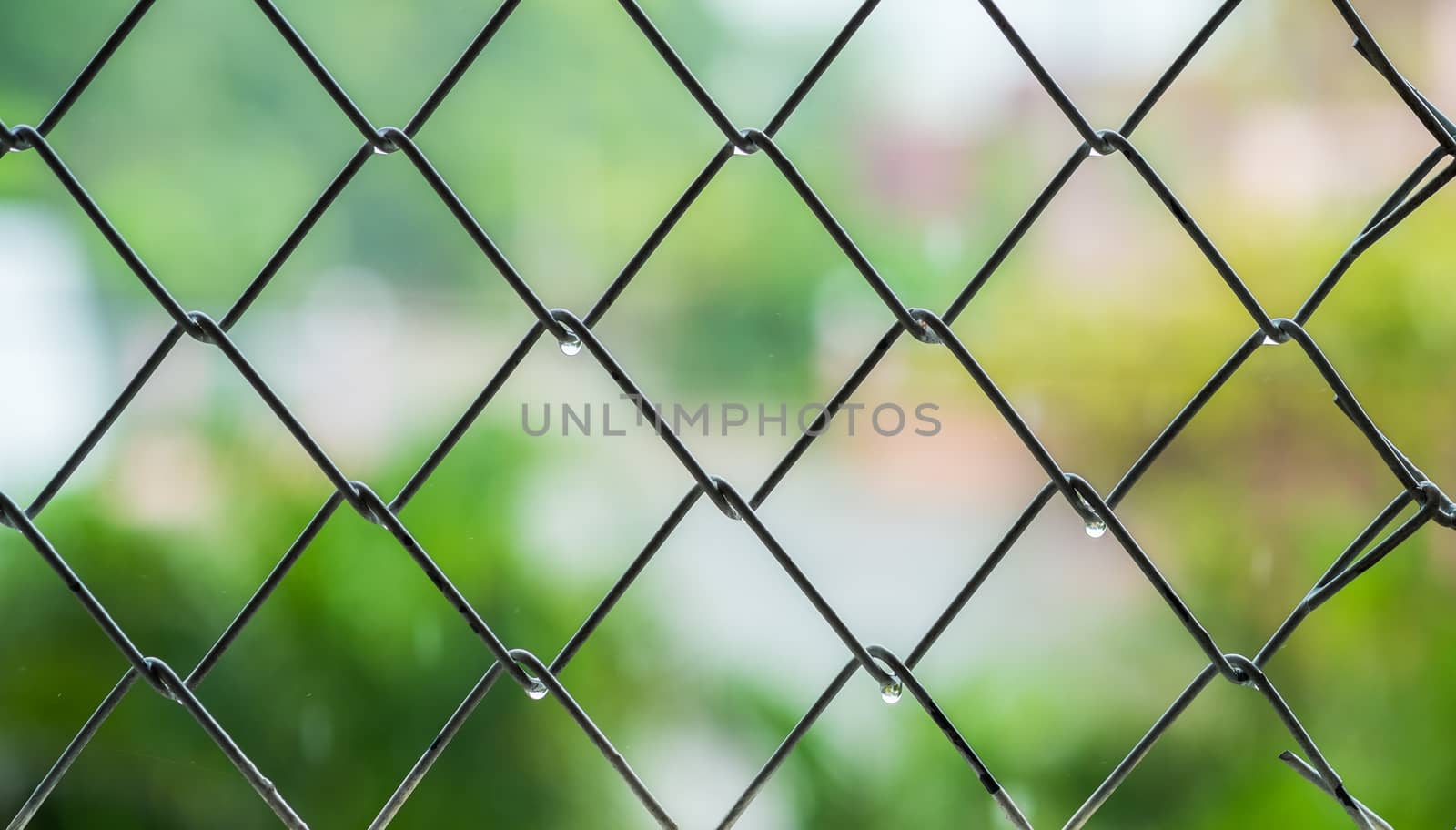 Steel cage with blur background in raining day