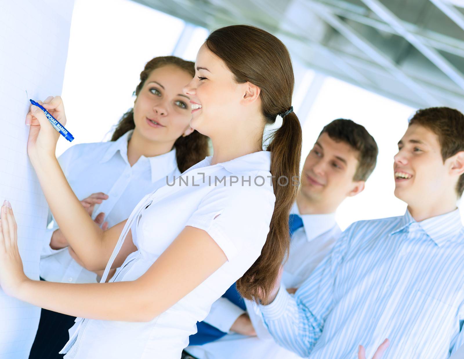 business consultant discussing with colleagues around the flipchart, teamwork