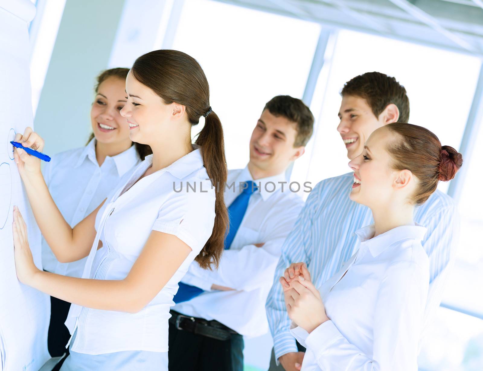 businessmen are meeting near the flipchart by adam121