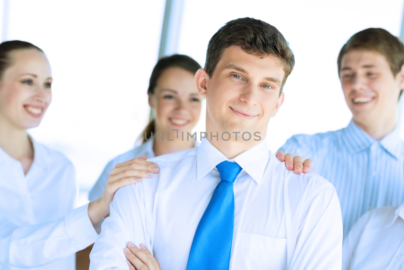 businessman receiving congratulations from his colleagues, business achievements