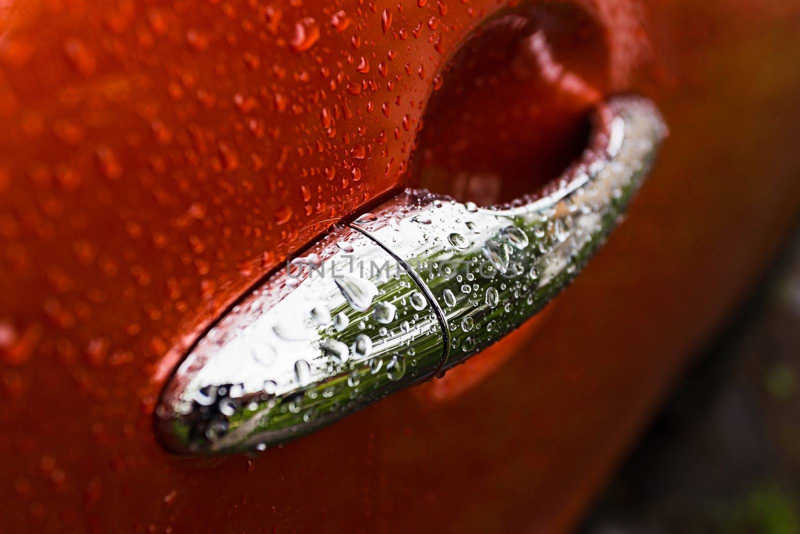 Handle orange car is wet from the rain