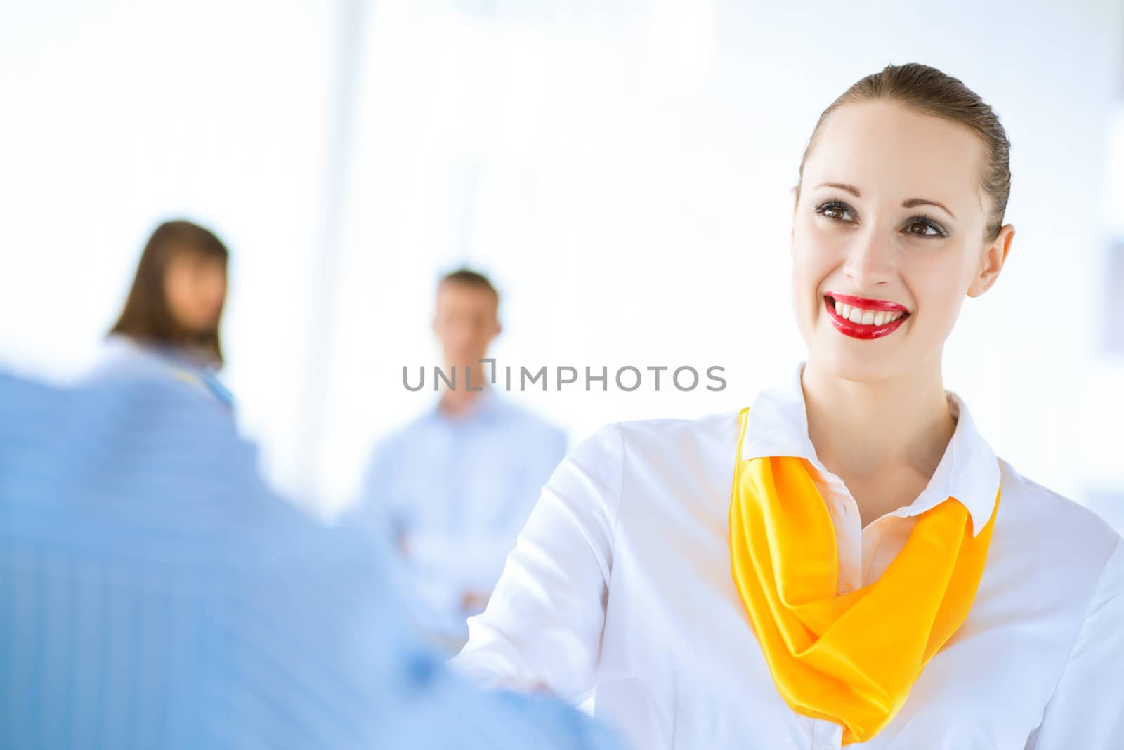 Business woman shaking hands and smiling colleague