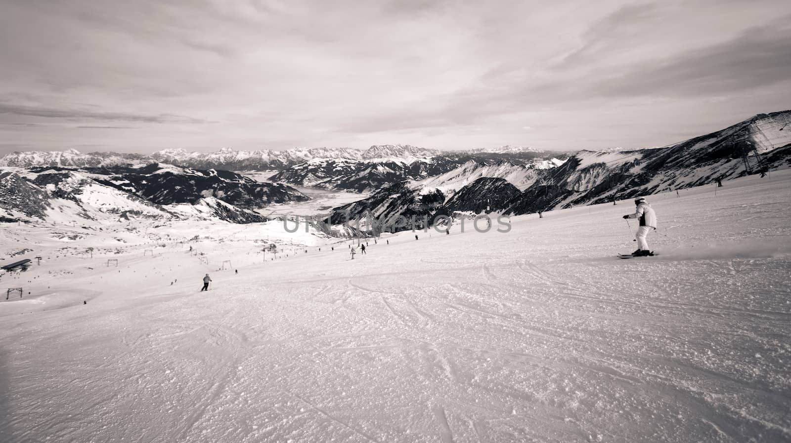 winter with ski slopes of kaprun resort next to kitzsteinhorn peak in austrian alps
