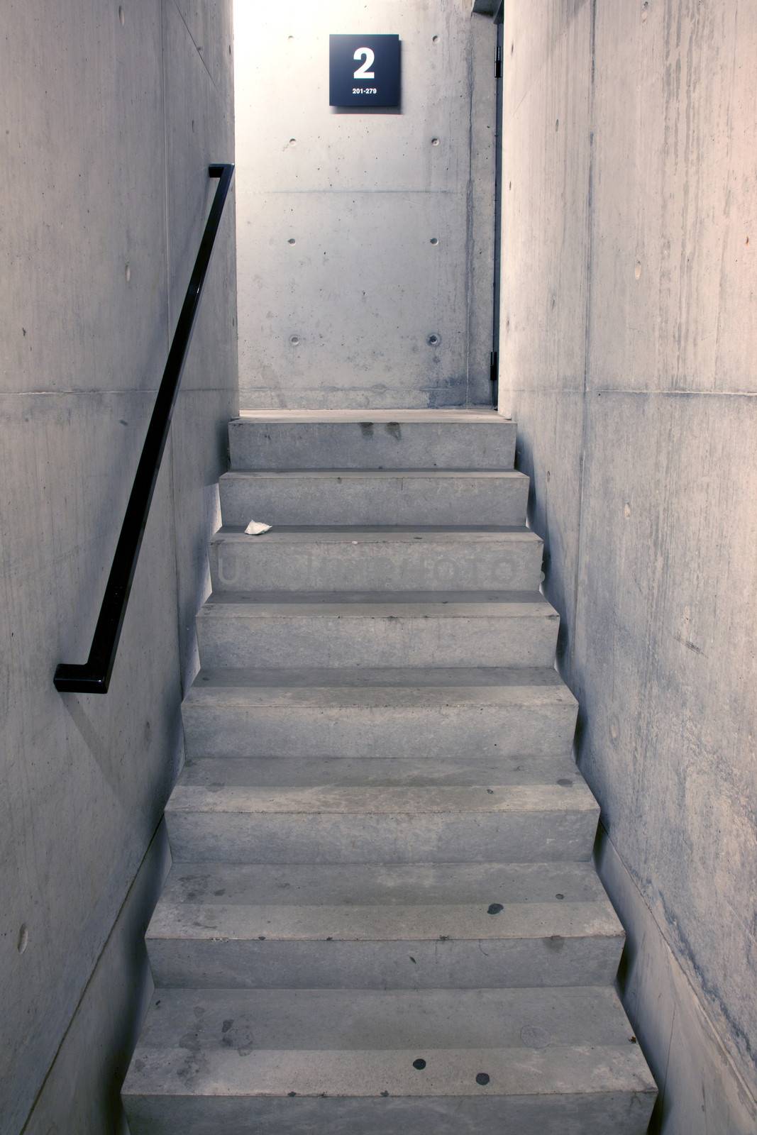 concrete staircase and stairs leading upwards to second floor by ahavelaar