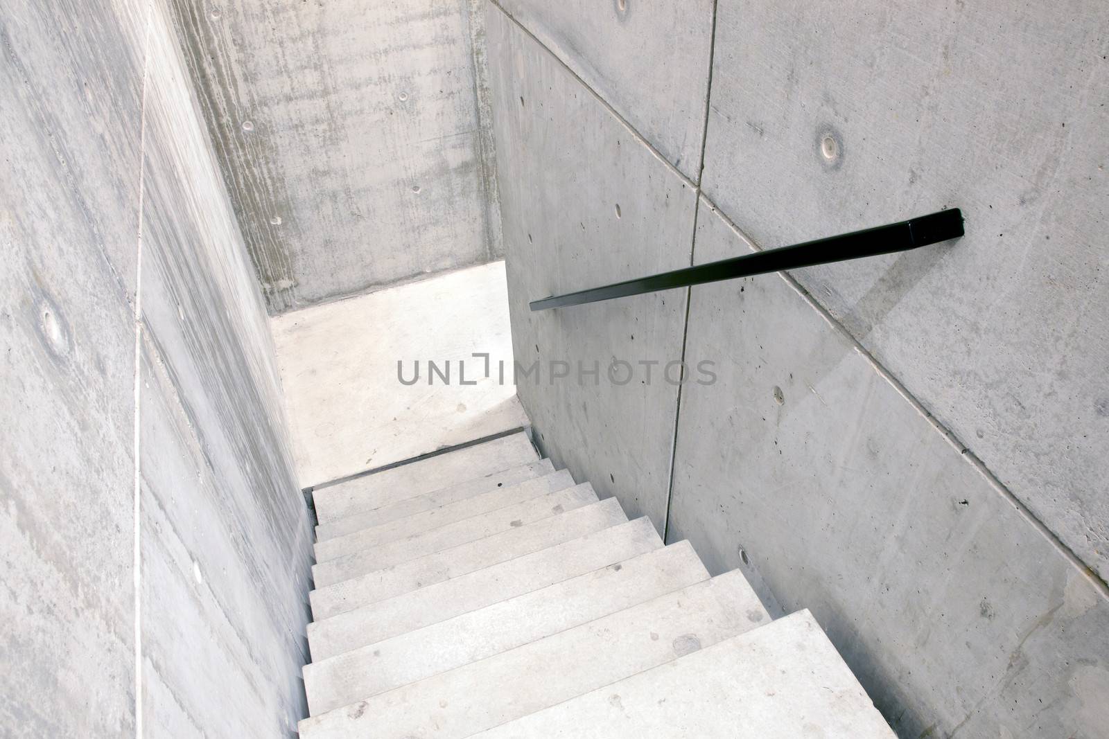 concrete staircase of parking garage and stairs leading down