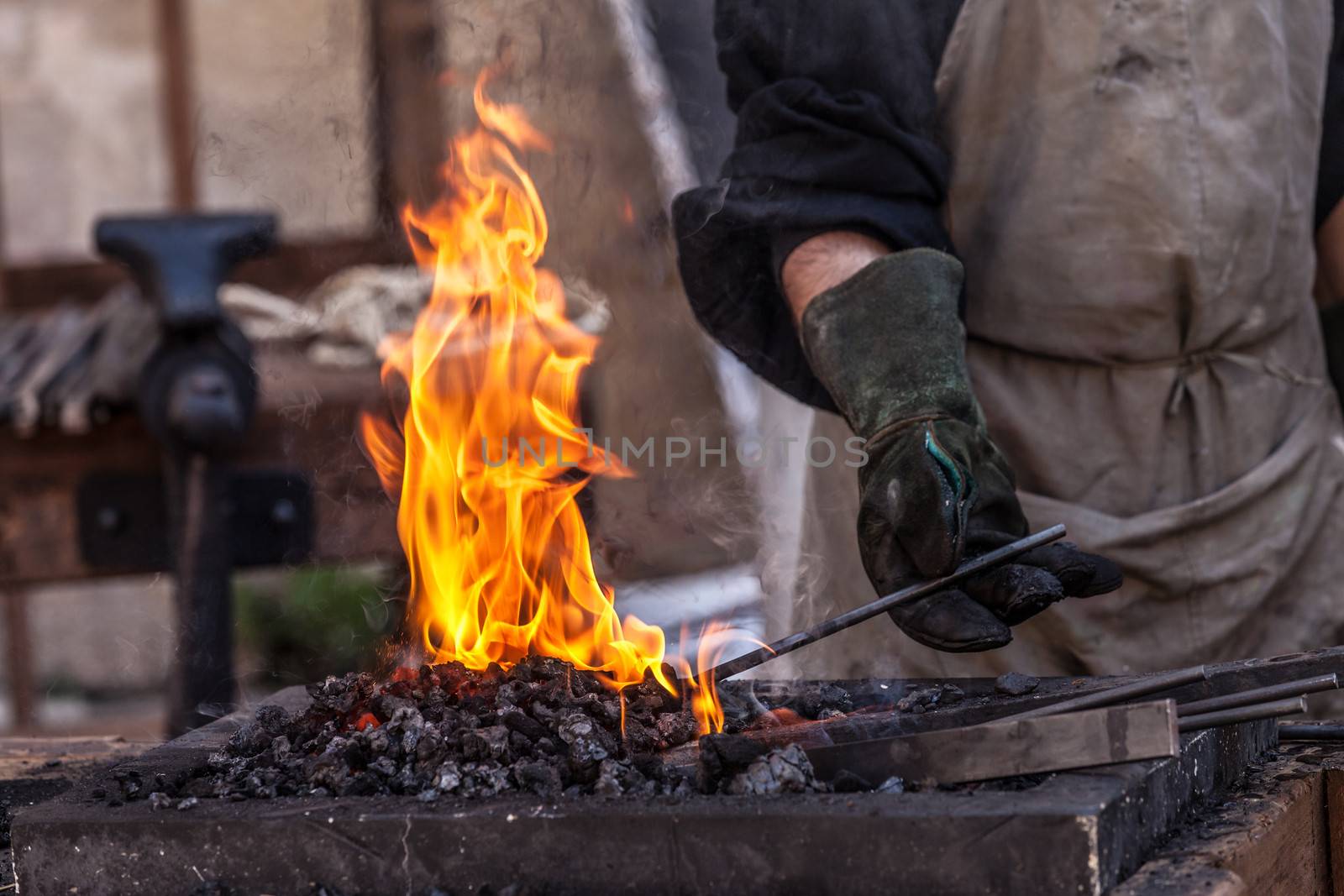 Detail shot of metal being worked at a blacksmith forge