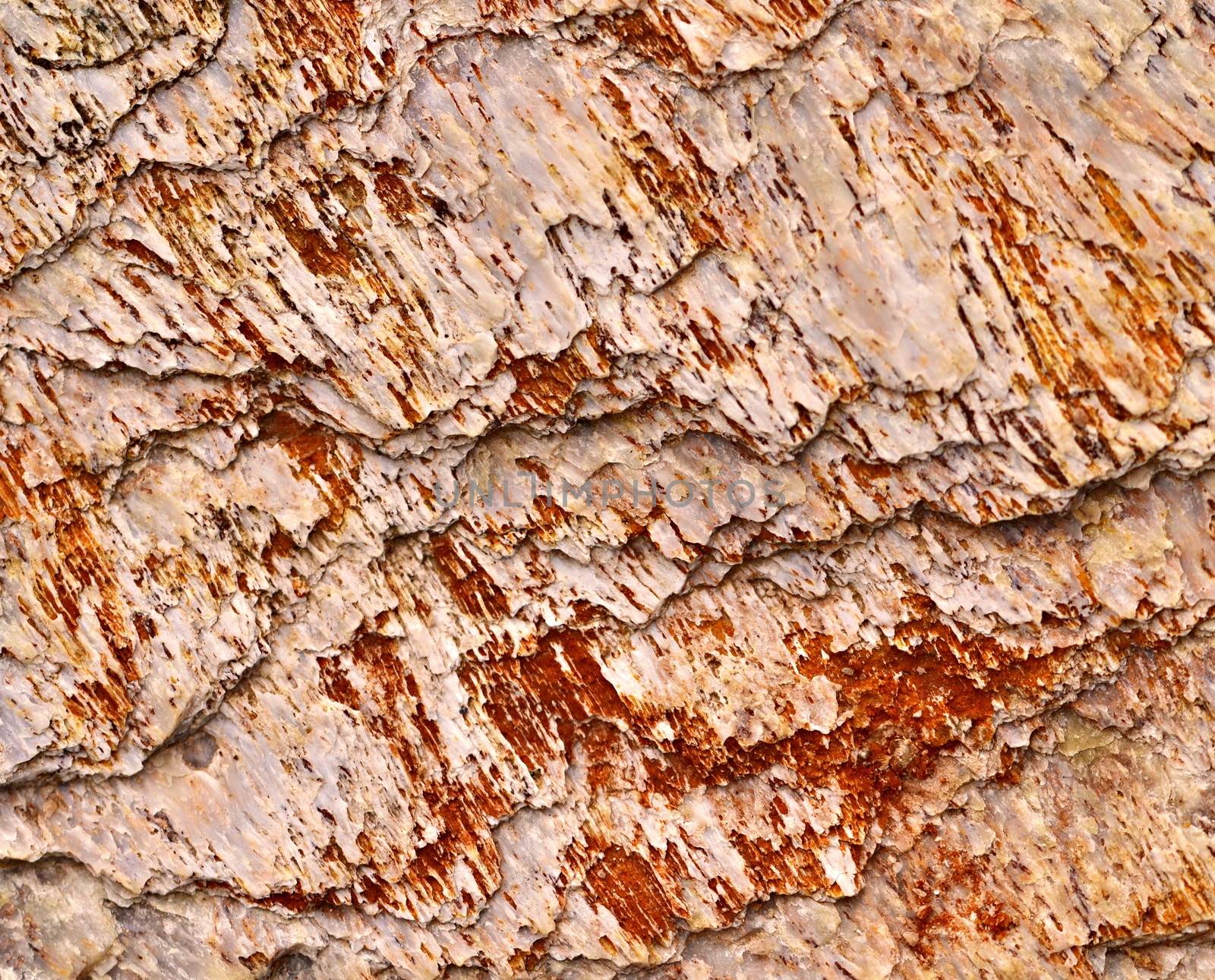 background or texture of carved quartz with red grooves
