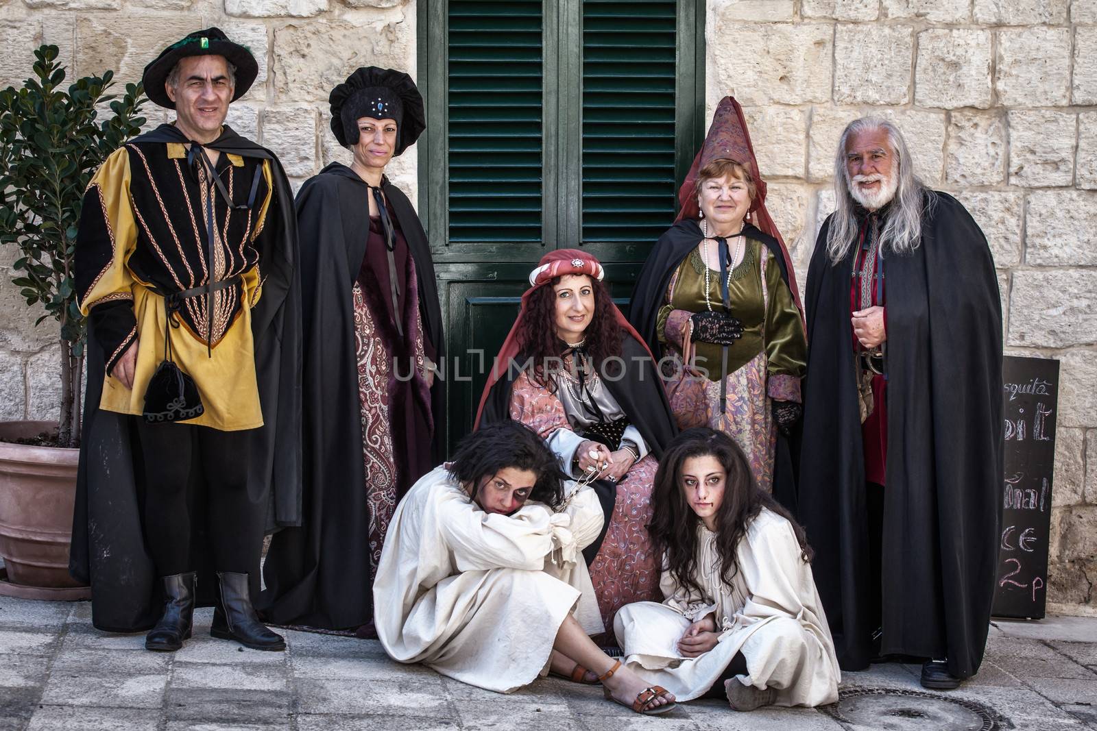 MDINA, MALTA - APR 13 - People in medieval costume taking part in the Medieval Mdina festival in Mdina on 13 April 2013