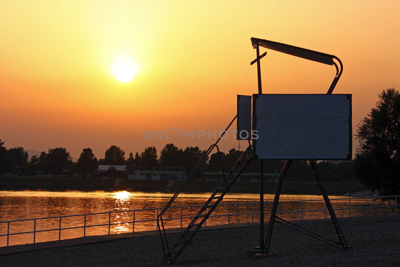 Colorful sunset on the beach, with lifeguard tower