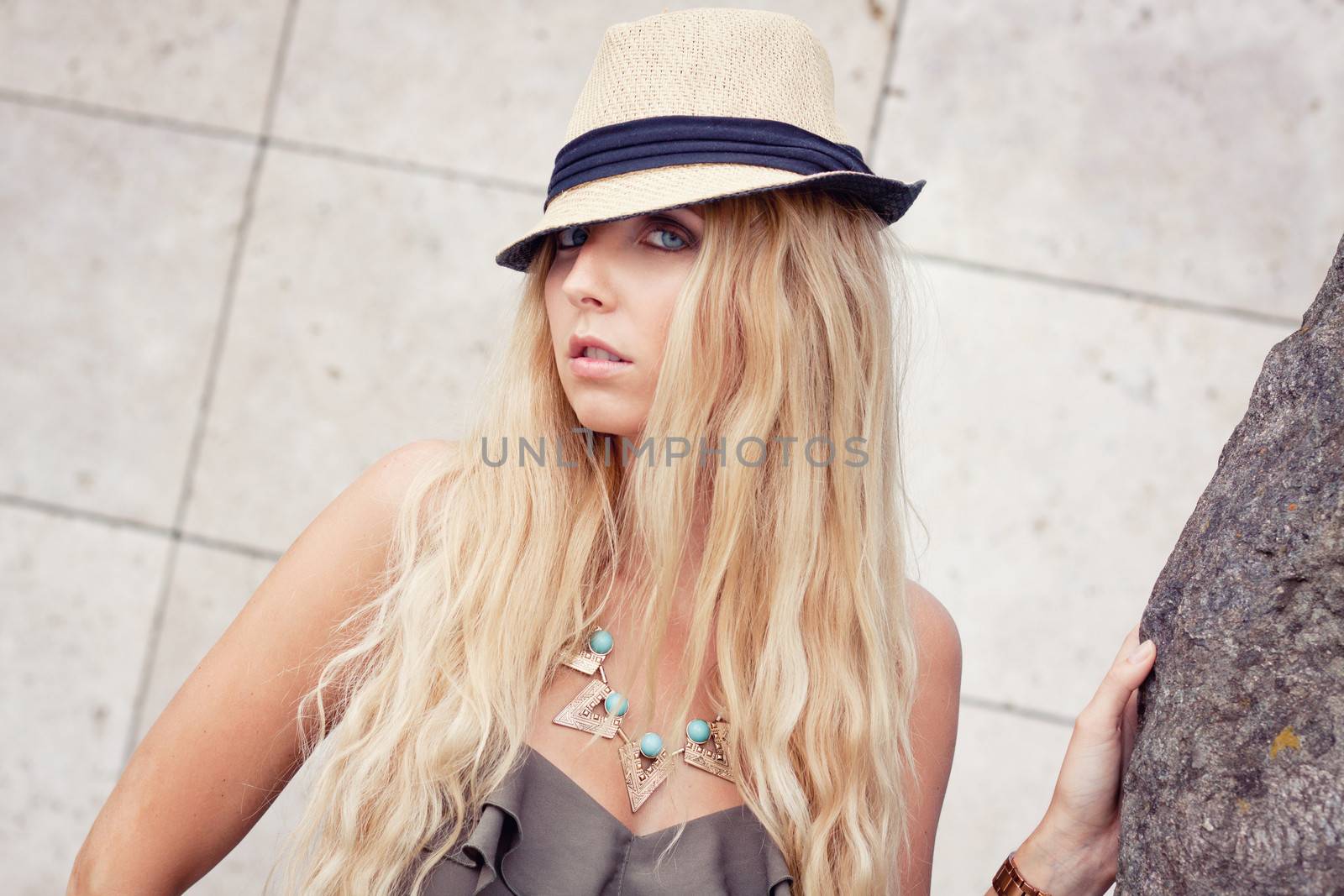 happy young blonde woman with hat outdoor summertime fashion beauty
