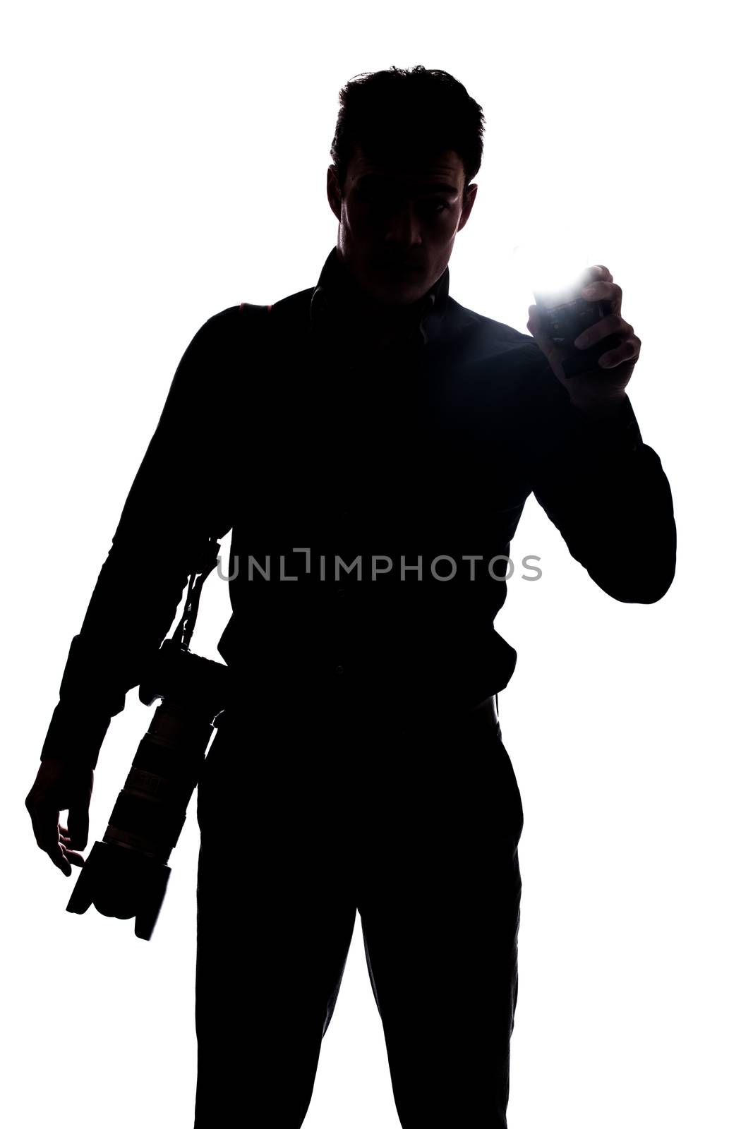 Photographer flashing at the camera in silhouette isolated over white background