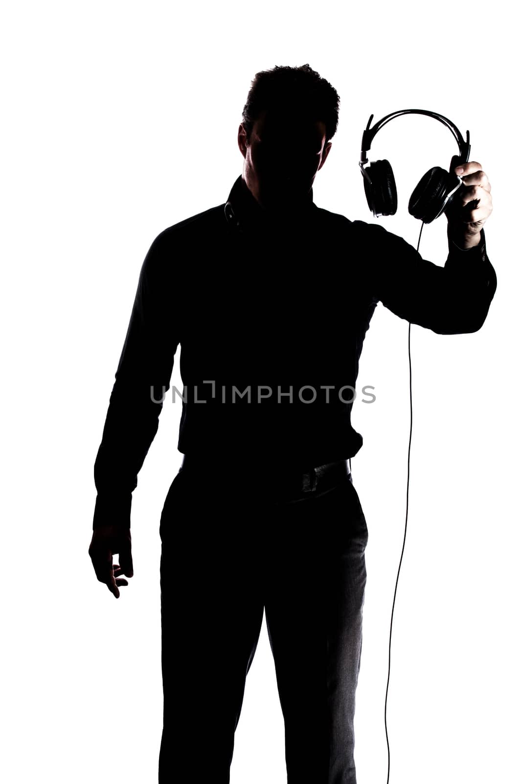 Male in silhouette showing headphones isolated on white background