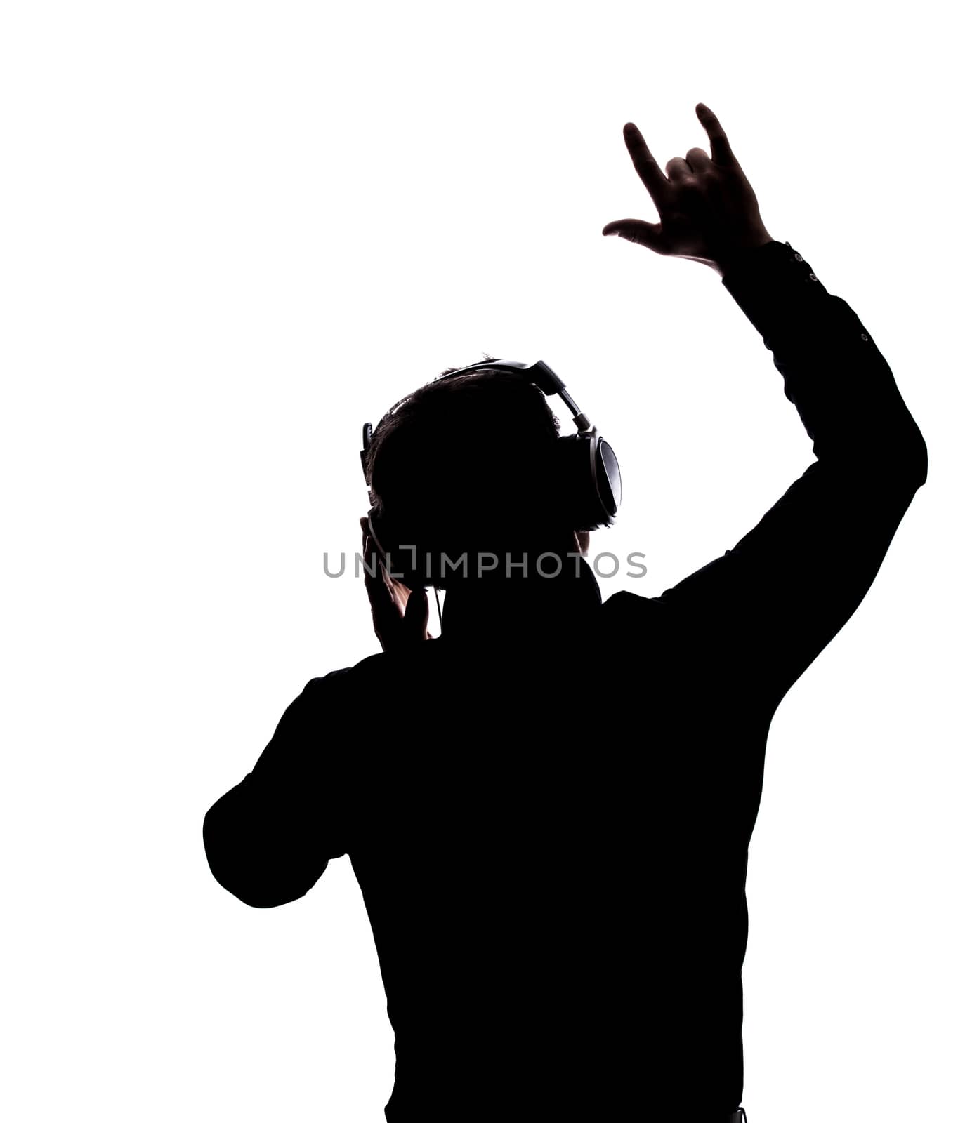 Man rocking on with headphones in silhouette isolated over white background