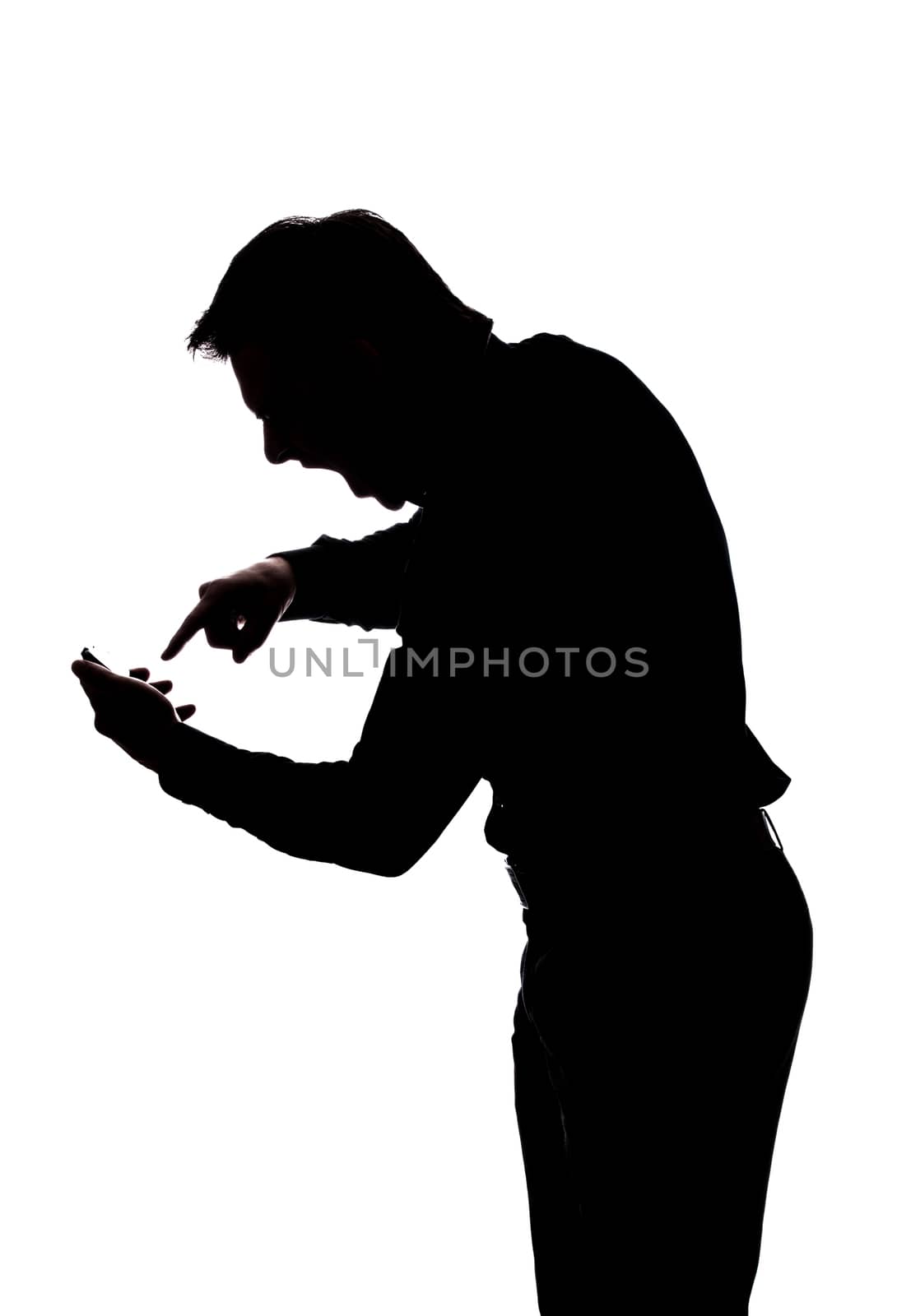 Furious man yelling at his cellphone in silhouette isolated over white background