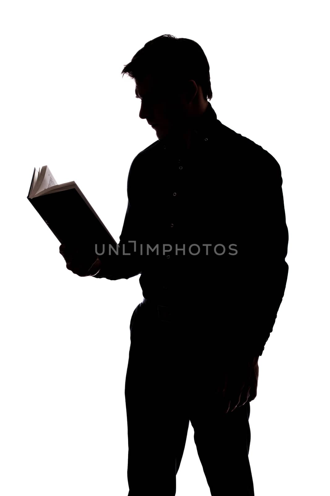 Man reading a book in silhouette and isolated on White background