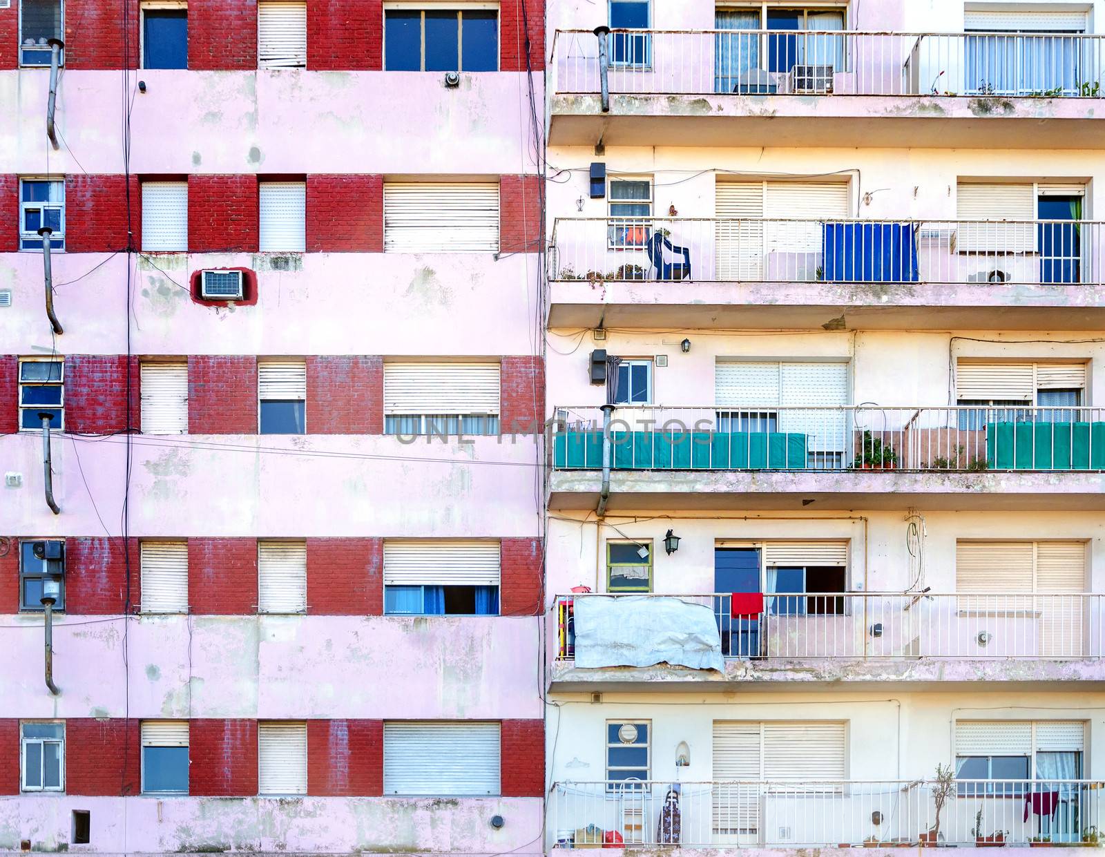 Facades of two poor apartment buildings in La Boca neighborhood of Buenos Aires