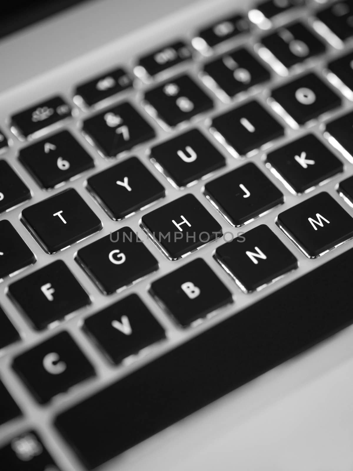 A laptop computer on a work desk