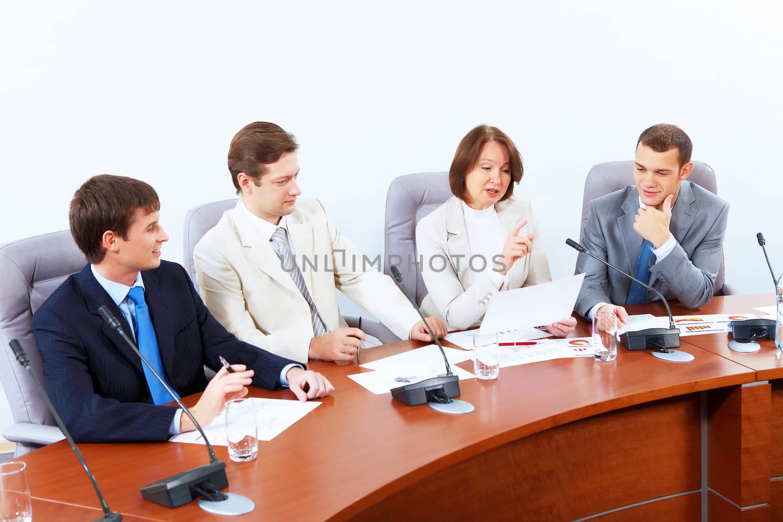 Four businesspeople at meeting by sergey_nivens