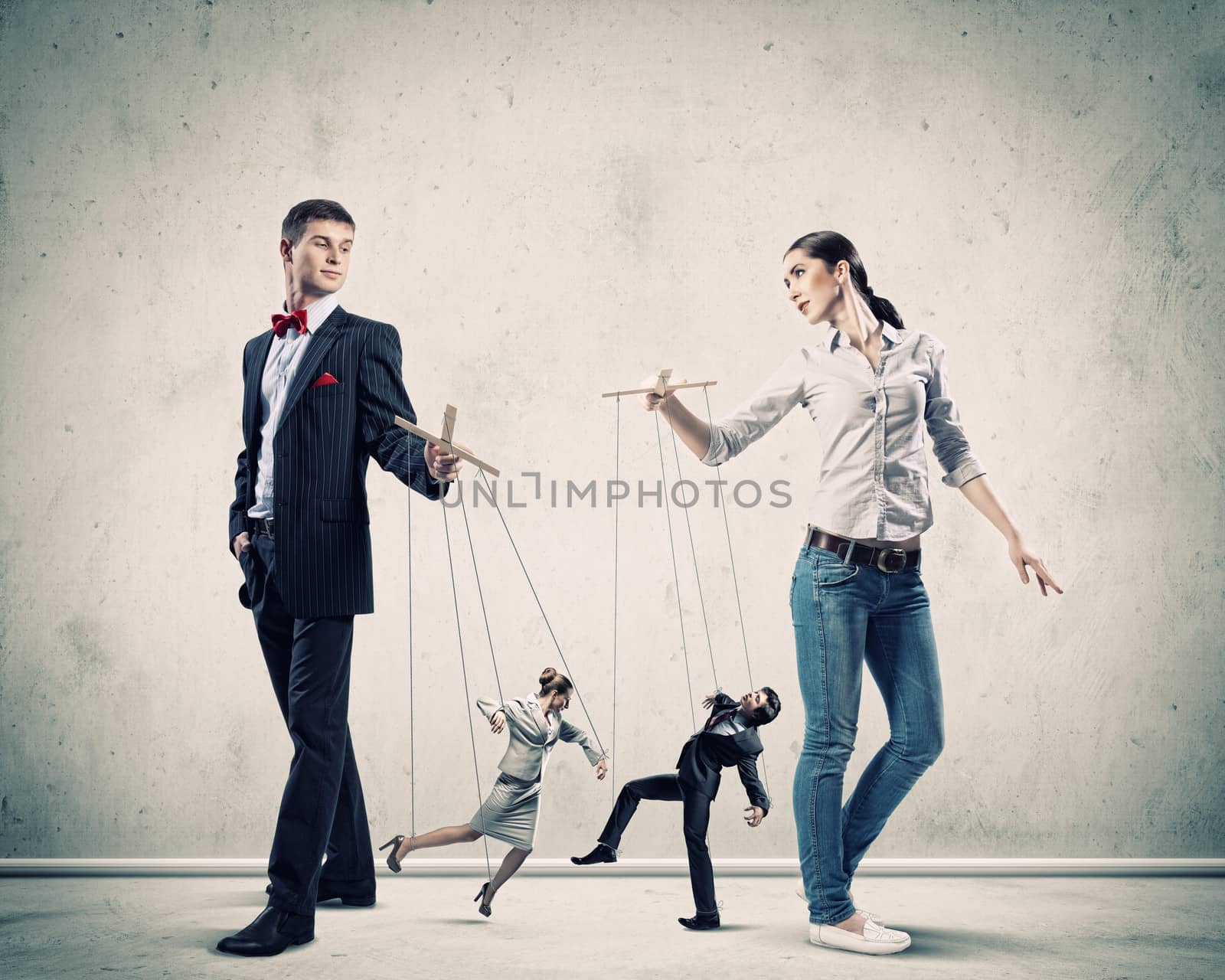 Image of man and woman with marionette puppets