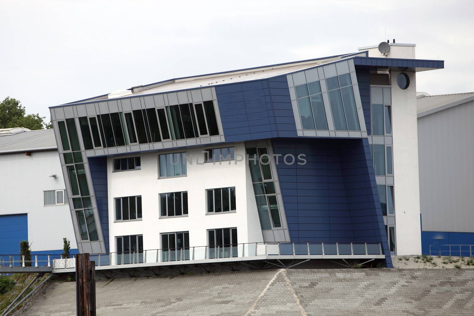 Three-floor building with modern futuristic architecture, exterior view