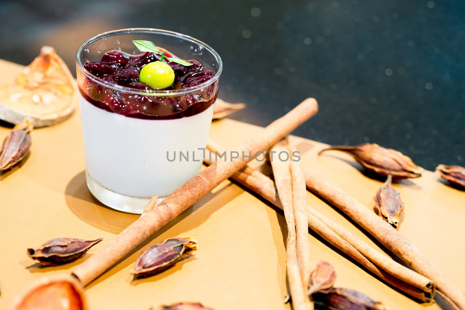 panna cotta with sauce of blackberries with ingredients background
