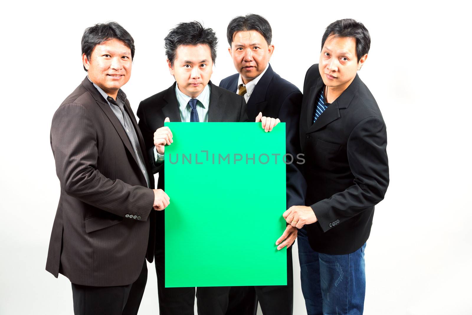 Team of Businessmen holding a blank green banner