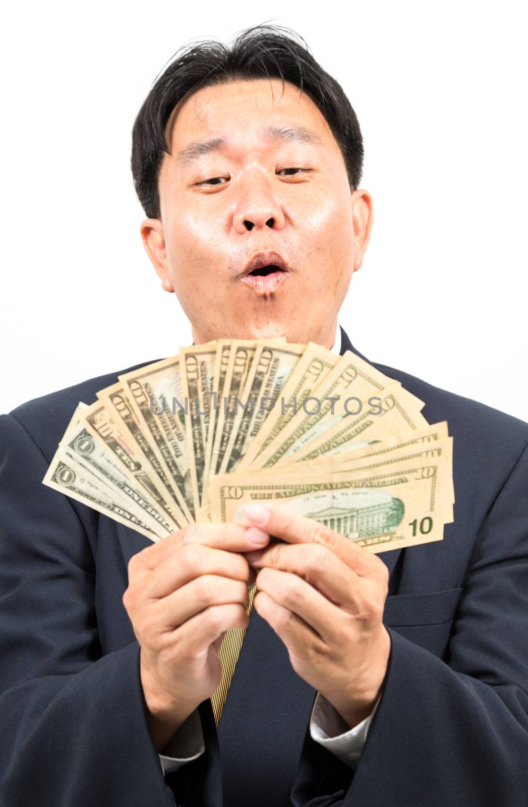 Businessman holding money isolated over white background