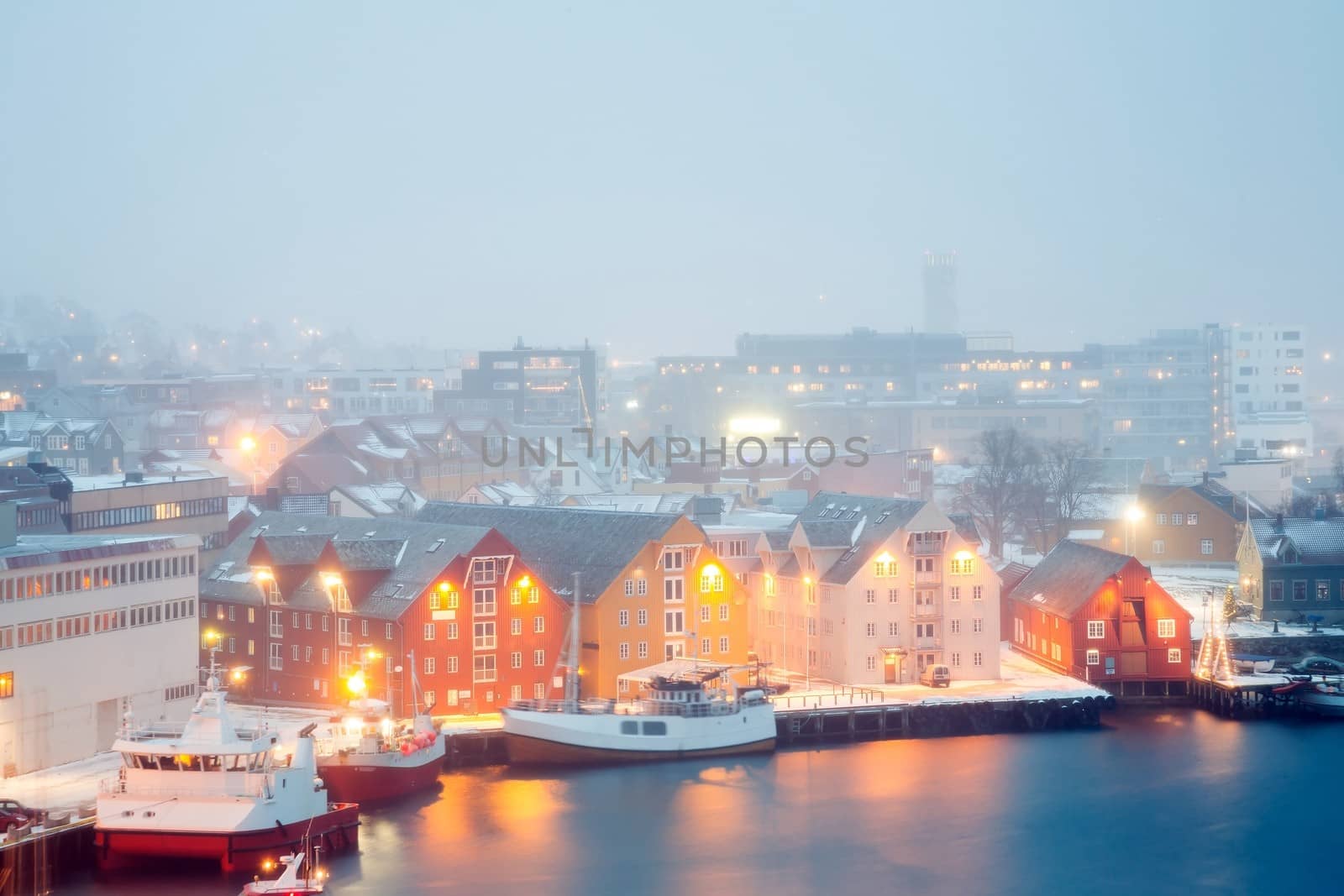 Aerial view of Tromso Cityscape at dusk with winter mist Norway