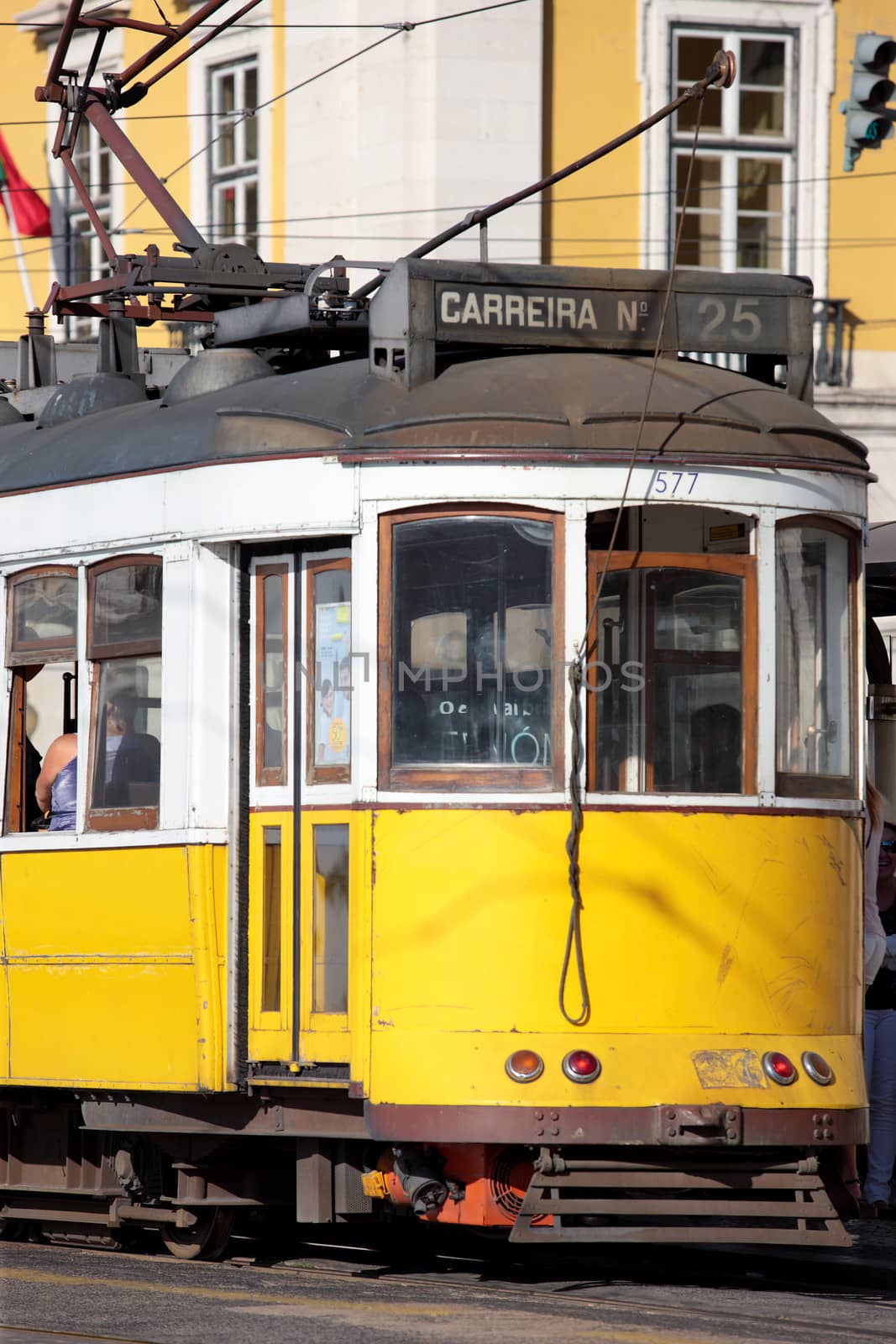 Yellow tram on narrow street, Alfama district of Lisbon. Portugal 