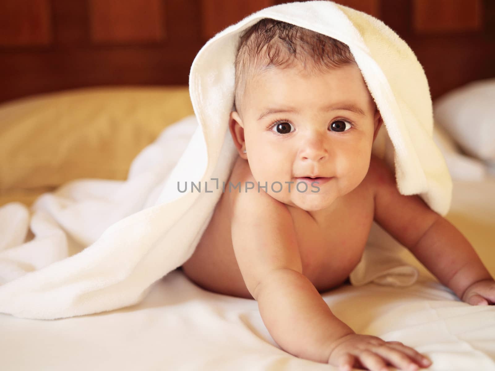 beautiful caucasian baby on a bed