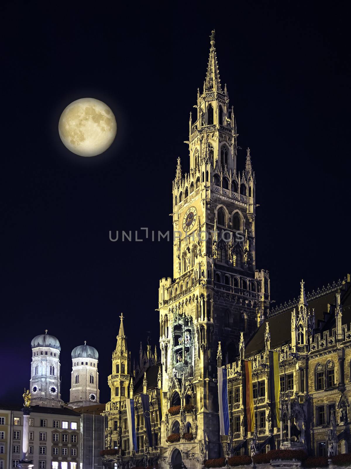 Night scene from Munich Town Hall and Frauenkirche with moon in Germany Bavaria