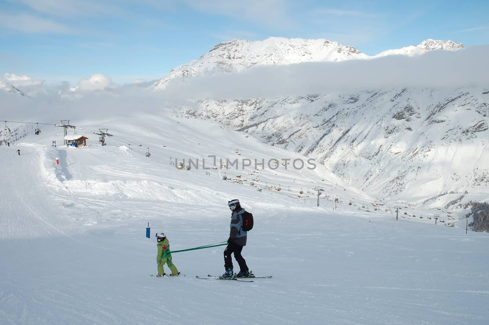 Little child is learning to ski in Livigno Italy