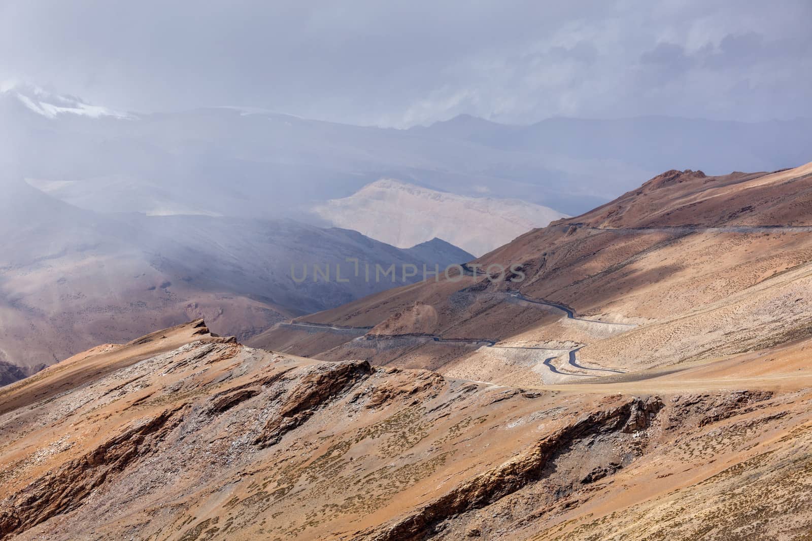 Road in Himalayas in clouds near Tanglang la Pass  - Himalayan mountain pass on the Leh-Manali highway. Ladakh, India