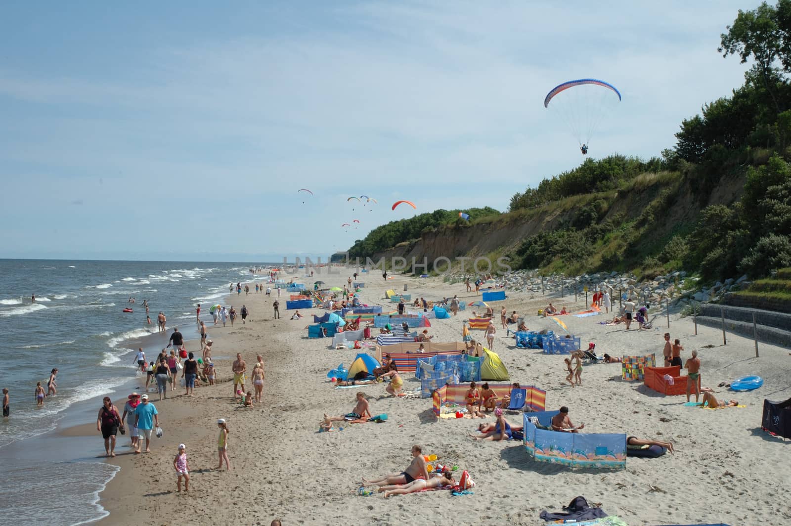 Beach and paragliders by janhetman