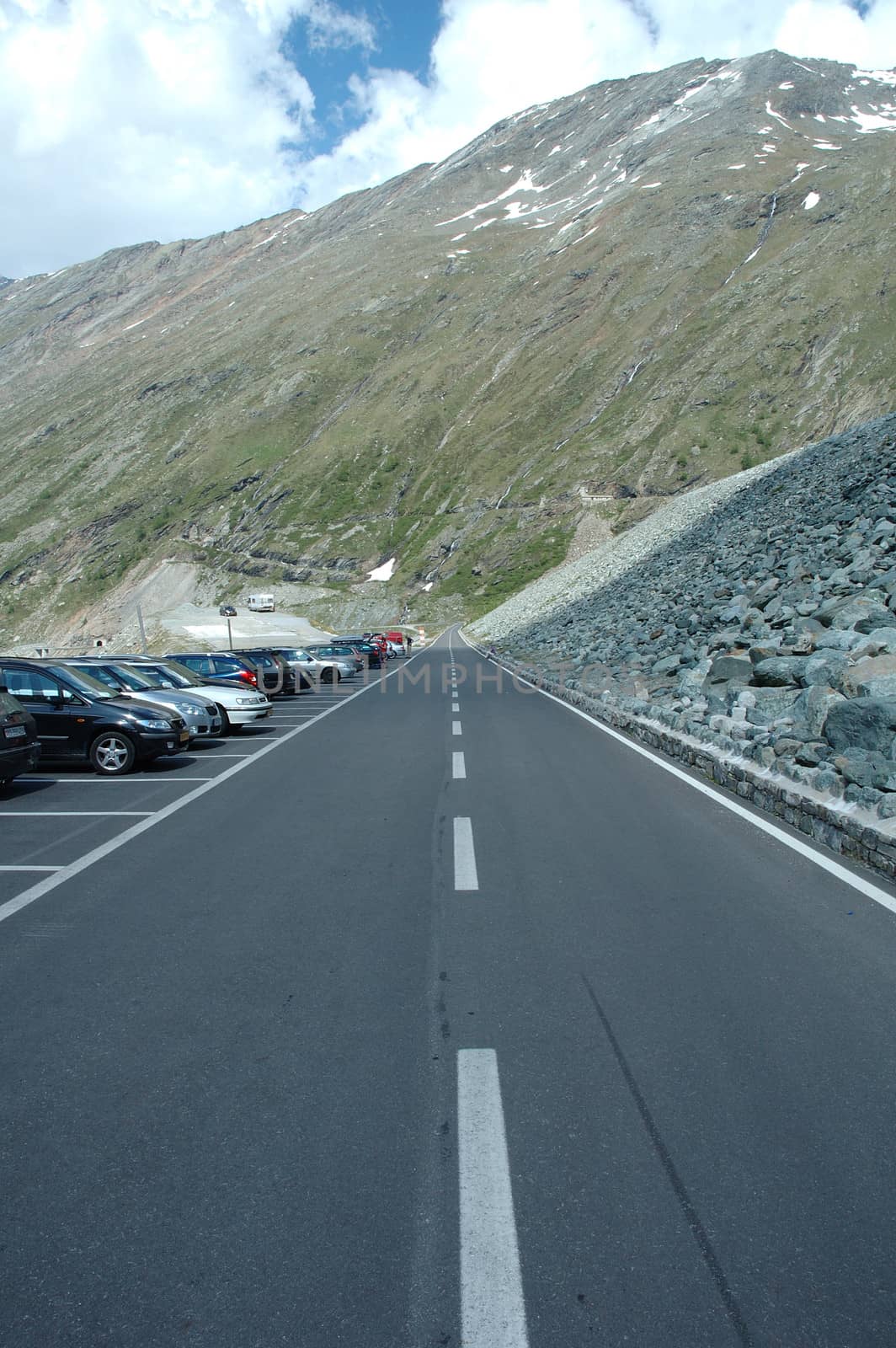 Road by mattmark dam in Alps in Switzerland