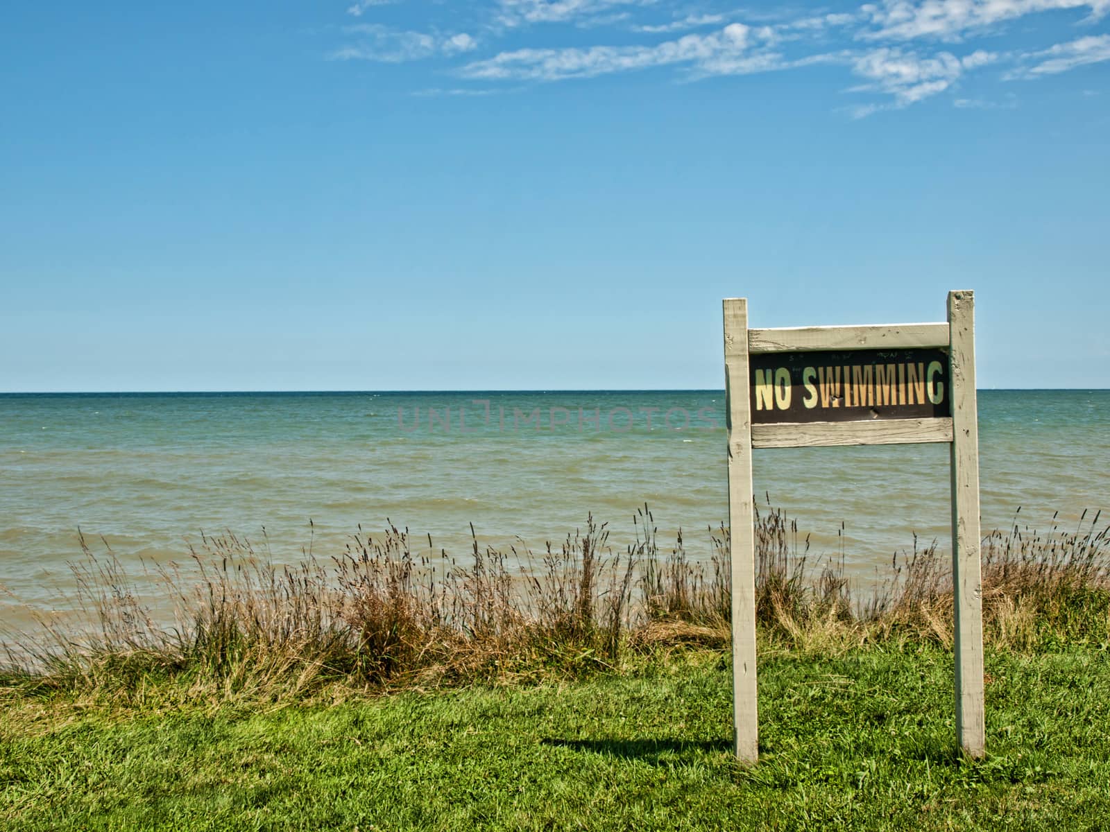 no swimming sign on the shores of lake ontario, huron,new york