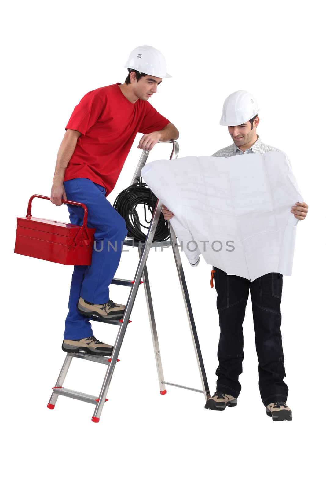 architect unfolding blueprints and electrician on ladder