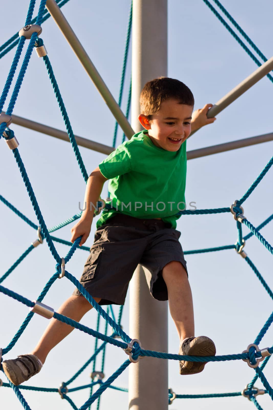 Child playing on the play structure in the park